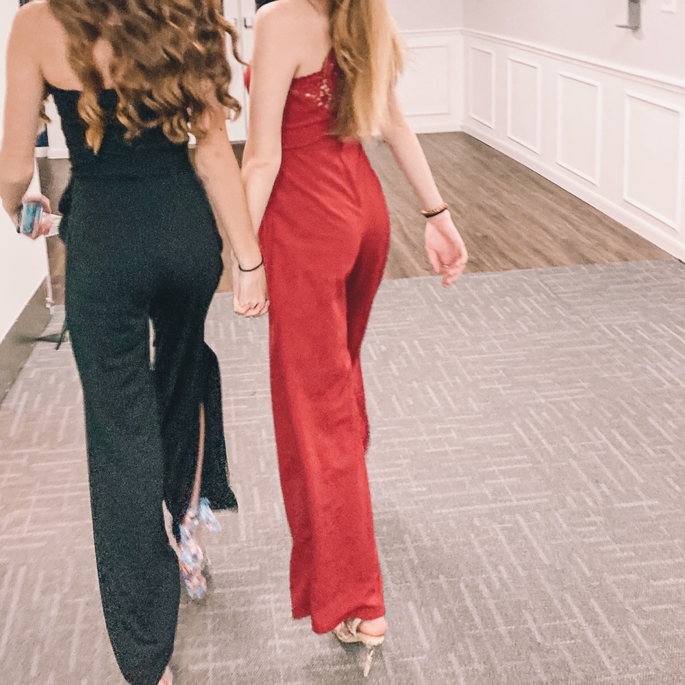 Francesca’s red jumpsuit with lace-type back